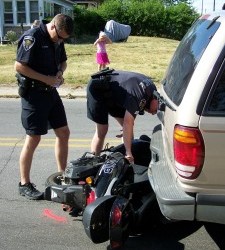 One Flown After Scooter Collides With SUV